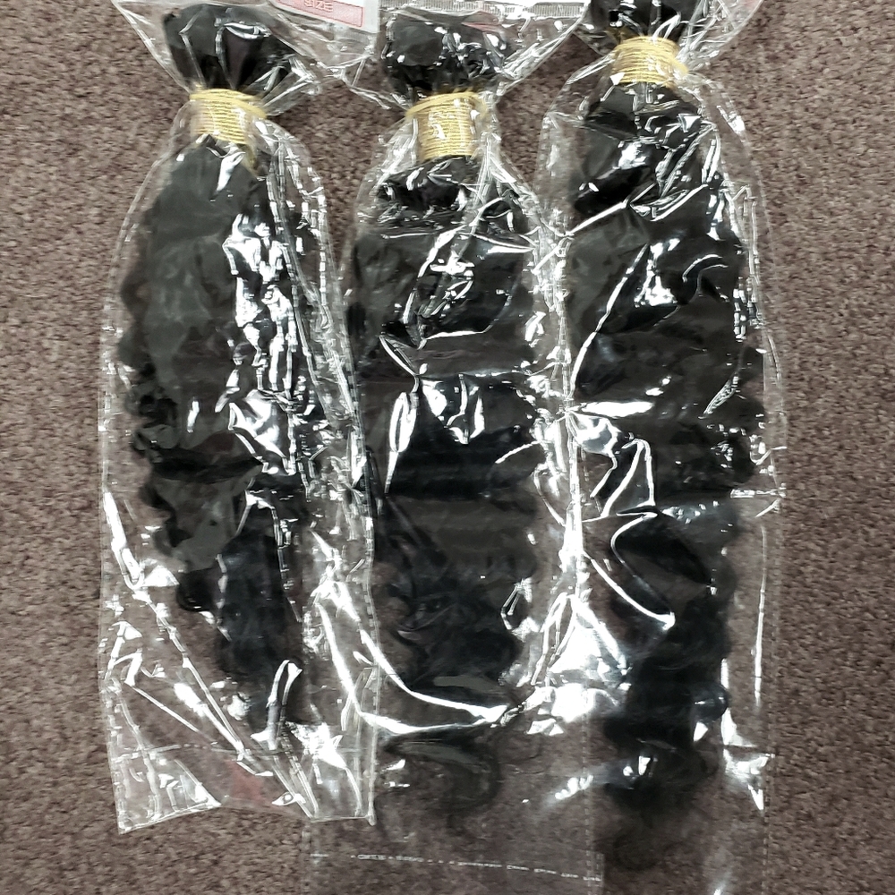 100% human Brazilian hair 16, 18, and 20" deal!